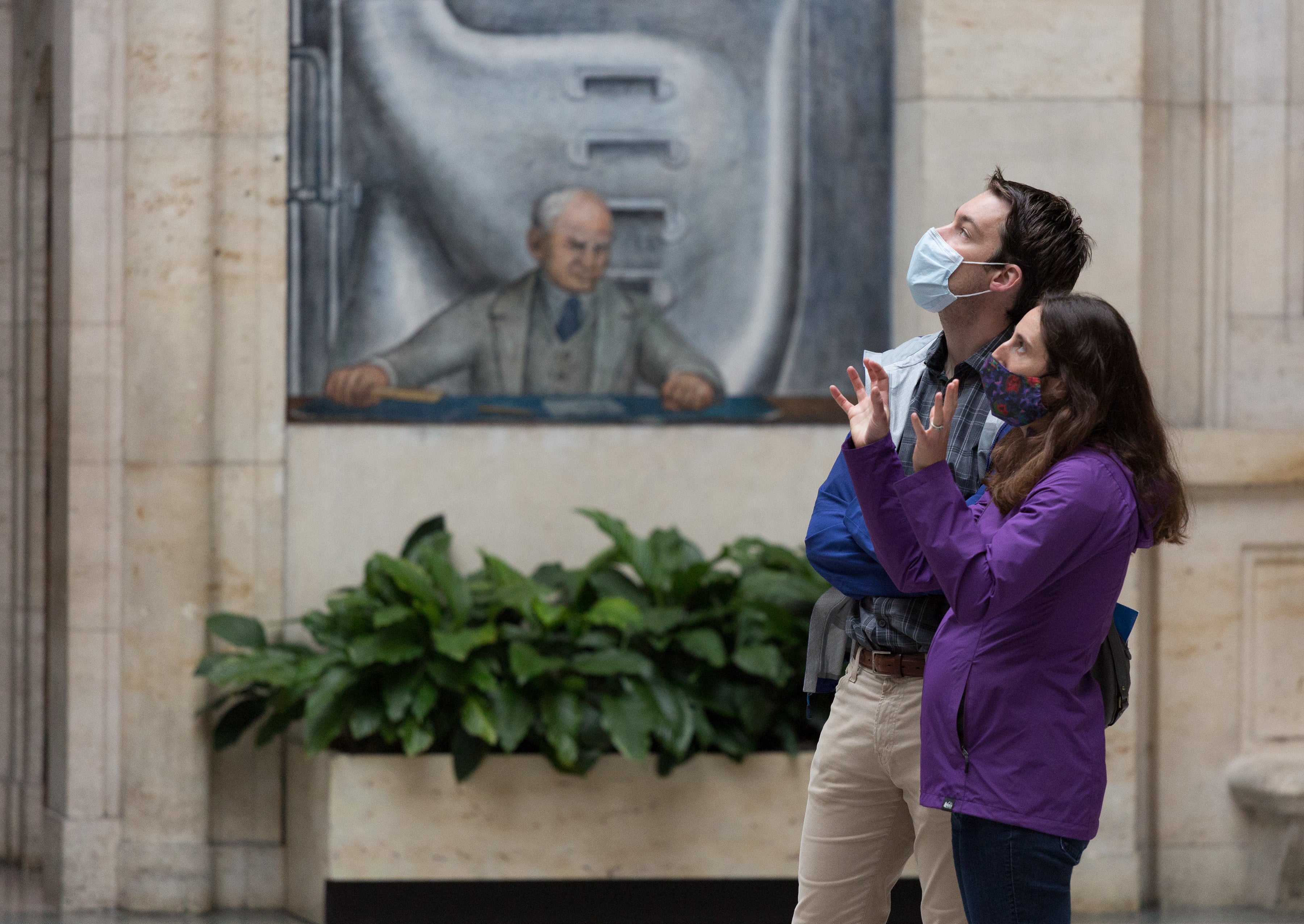 Two visitors wearing face masks in Rivera Court