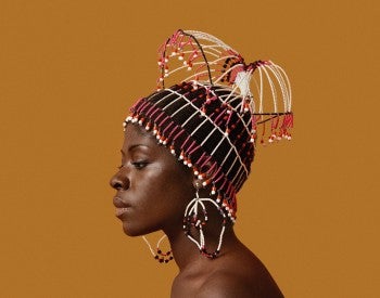ikolo Brathwaite wearing a headpiece