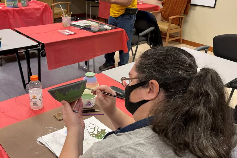 Two artists making bowls